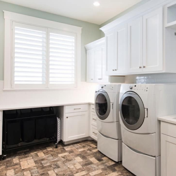 White polywood shutters in laundry room