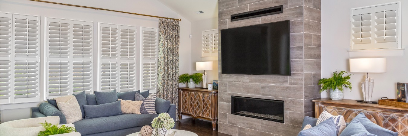 Interior shutters in Greenwood family room with fireplace