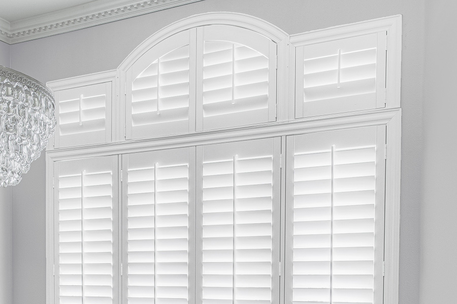 White Polywood Palladian windows in a dining room.