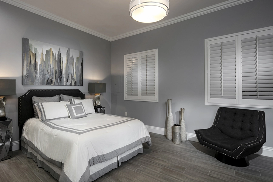 Close your custom Polywood shutters to beat the heat and keep your Indianapolis bedroom cool. White Polywood shutters on bedroom windows