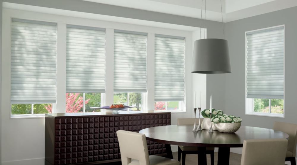 Custom cordless roller shades have a clean look and are appropriate for any room. Cordless motorized shades in a Indianapolis dining room