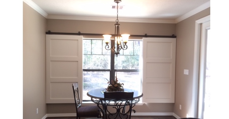 Barn doors open horizontally with slides instead of cords. Indianapolis barn door shutters