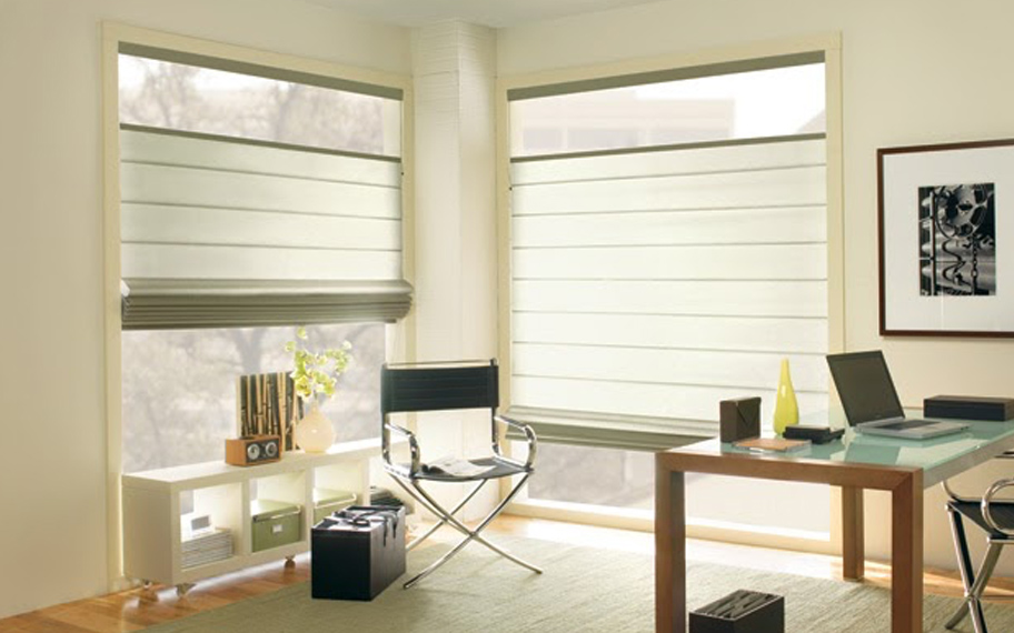 Upgrade your windows with stylish window shades or shutters in Indianapolis. Stylish sheer shades in the corner of a modern office.
