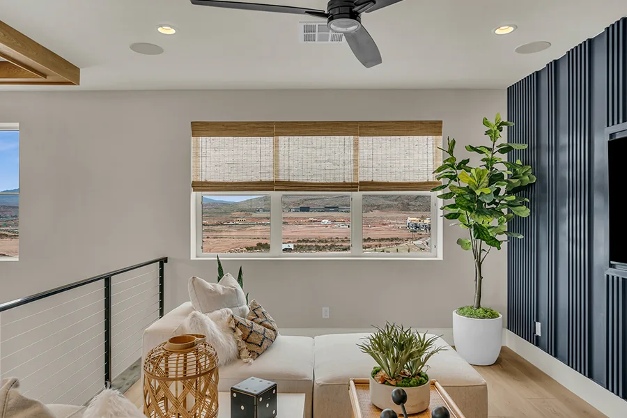 Indianapolis homeowners who want eco-friendly home fixtures should consider natural woven shades. Natural brown woven shades on a window in a stylish sitting area
