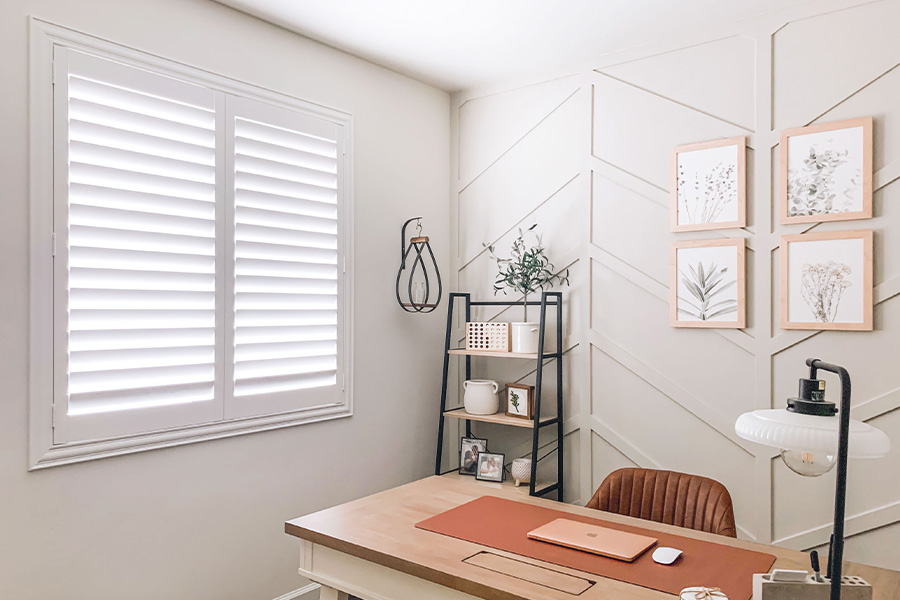 Polywood shutters give you maximum control over natural light in your Indianapolis home. Photo Credit: @OurLakepoint Farmhouse  White and off-white farmhouse style office with natural light from polywood shutters.