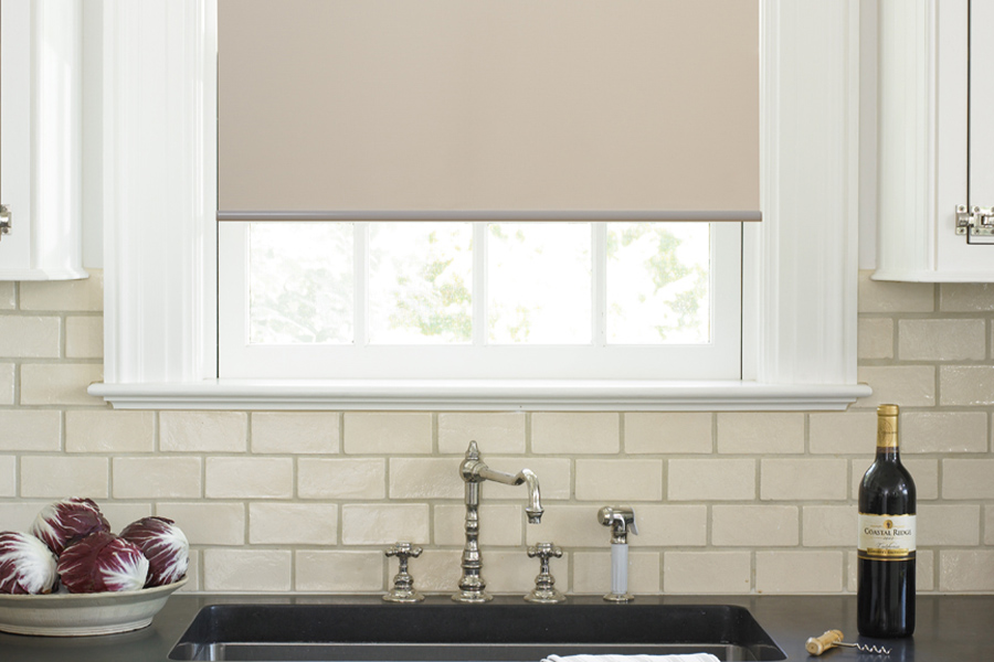 Roller shades opens up a lot of color and style options for your gourmet kitchen at Indianapolis. Roller shade above a kitchen sink.