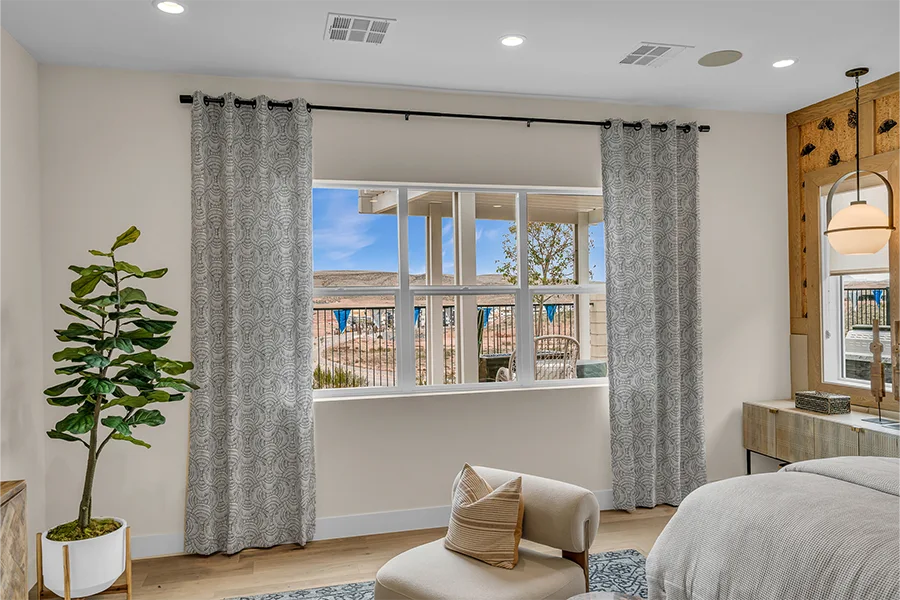 Gray patterned drapes alone on a bedroom window