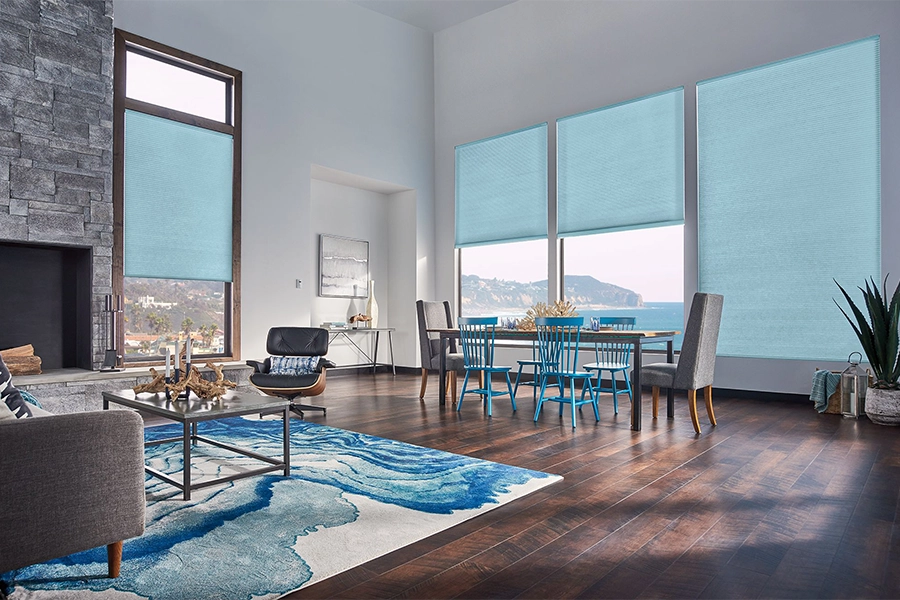 Smart motorized window shades are perfect on tall windows in your Indianapolis home. Blue motorized shades on tall living room windows