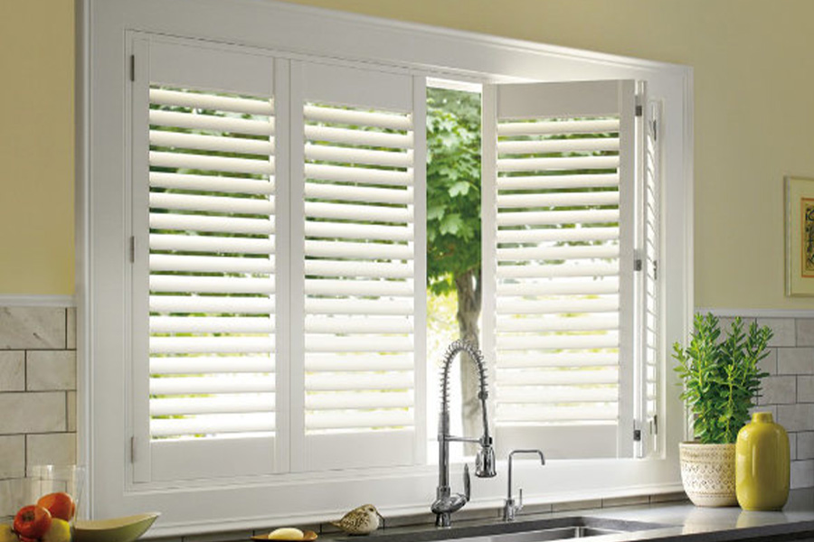 Polywood shutters are built to withstand the test of time in Indianapolis. White Polywood shutters above a kitchen sink.